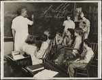 Teacher at Blackboard in Schoolroom