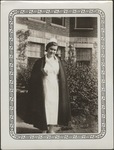 Nursing Student with Coat in Front of Building
