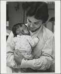 Nurse Holding Infant